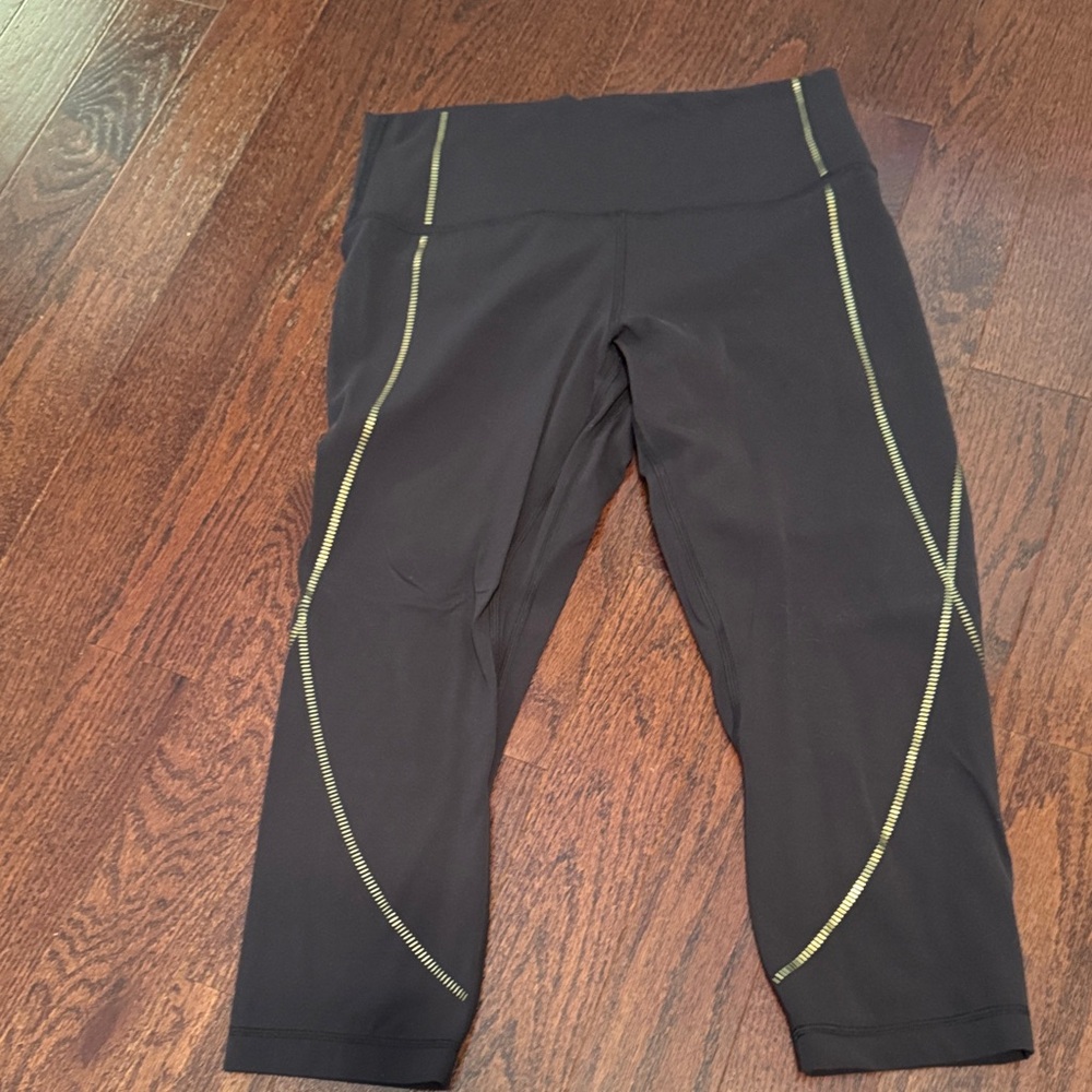 Lululemon Athletica Black Leggings with Gold Details